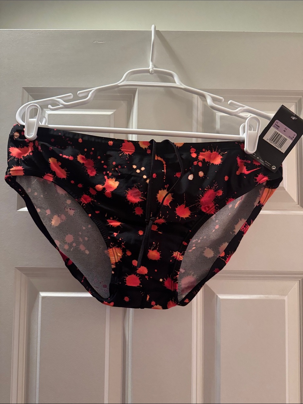 Nike Men’s Black Swim Briefs with Red and Orange Splatter Size 38.